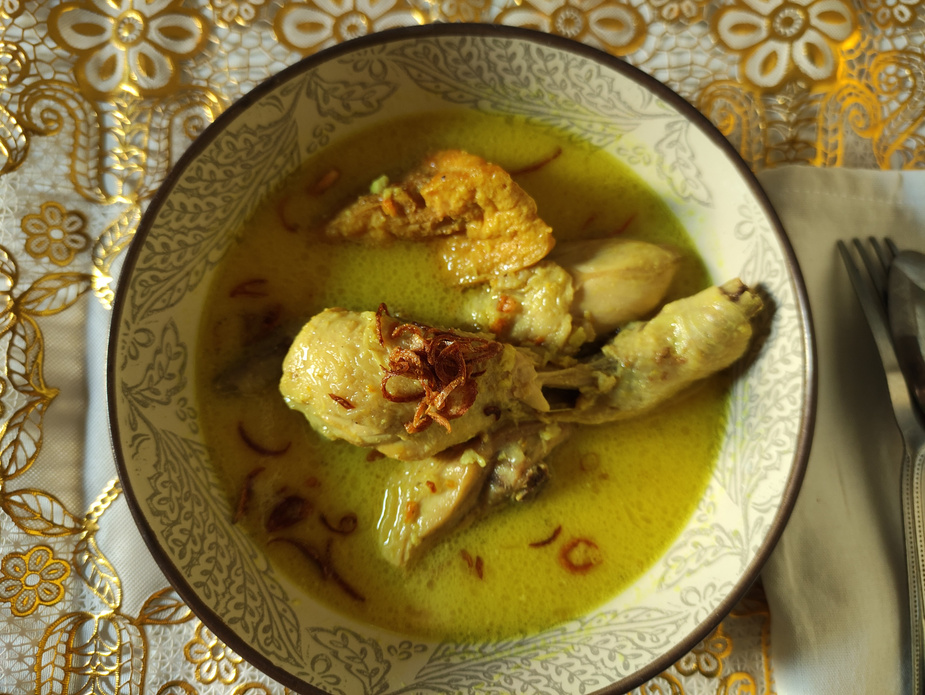 chicken braised in coconut milk or called  Opor ayam